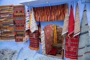 Blue street and houses in Chefchaouen, Morocco. Beautiful colored medieval street painted in soft blue color. photo