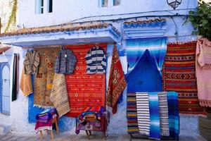 Blue street and houses in Chefchaouen, Morocco. Beautiful colored medieval street painted in soft blue color. photo