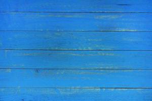 Vintage blue wood background texture with knots and nail holes. Old painted wood wall. Blue abstract background. Vintage wooden dark blue horizontal boards. photo