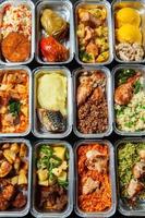 Business lunch in eco plastic container ready for delivery.Top view. Office Lunch boxes with food ready to go. Food takes away. Catering, brakfast. photo