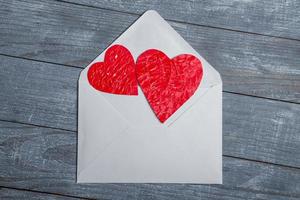 Love hearts on wooden texture background. Valentines day card concept. Heart for Valentines Day Background. photo