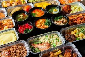 Business lunch in eco plastic container ready for delivery.Top view. Office Lunch boxes with food ready to go. Food takes away. Catering, brakfast. photo