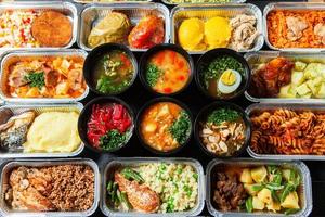 Business lunch in eco plastic container ready for delivery.Top view. Office Lunch boxes with food ready to go. Food takes away. Catering, brakfast. photo