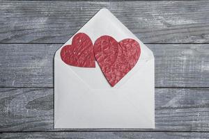 Love hearts on wooden texture background. Valentines day card concept. Heart for Valentines Day Background. photo