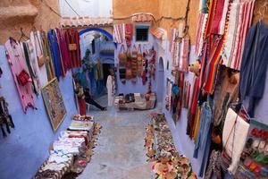 Blue street and houses in Chefchaouen, Morocco. Beautiful colored medieval street painted in soft blue color. photo