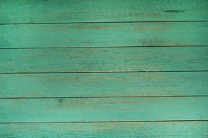 Vintage green wood background texture with knots and nail holes. Old painted wood wall. Brown abstract background. Vintage wooden dark horizontal boards. Front view with copy space photo