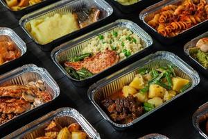 Business lunch in eco plastic container ready for delivery.Top view. Office Lunch boxes with food ready to go. Food takes away. Catering, brakfast. photo