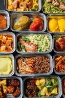 Business lunch in eco plastic container ready for delivery.Top view. Office Lunch boxes with food ready to go. Food takes away. Catering, brakfast. photo