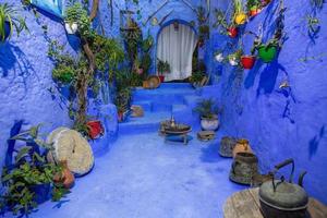 Blue street and houses in Chefchaouen, Morocco. Beautiful colored medieval street painted in soft blue color. photo