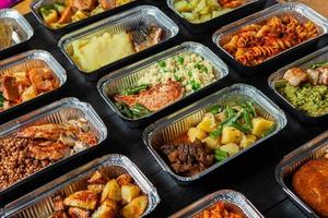 Business lunch in eco plastic container ready for delivery.Top view. Office Lunch boxes with food ready to go. Food takes away. Catering, brakfast. photo