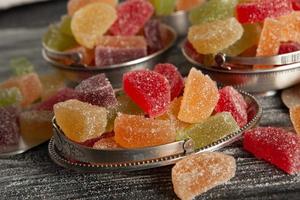 Collection of colorful marmalade candles. Sweet table with Bonbon Jars. photo