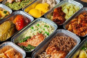 Business lunch in eco plastic container ready for delivery.Top view. Office Lunch boxes with food ready to go. Food takes away. Catering, brakfast. photo