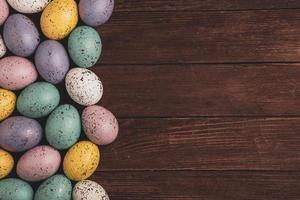 Hand painted pastel colored Easter eggs background. Happy Easter greeting card or invitation. photo