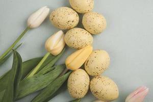 Hand painted pastel colored Easter eggs background. Happy Easter greeting card or invitation. photo