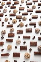 Assortment of delicious chocolate candies background. Chocolate candy isolated. photo