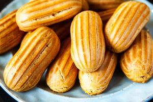 Traditional french eclairs with chocolate. Tasty dessert. Home made cake eclairs. Sweet Dessert Pastry filled with cream. Chocolate icing. photo