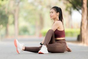 Beautiful Asian women exercise in the park every morning, It is a lifestyle for relaxation and good health of the body photo