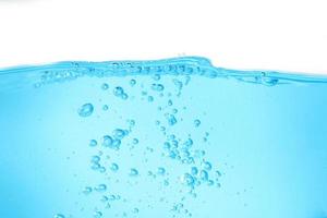 Blue surface water and air bubble isolated on white background photo