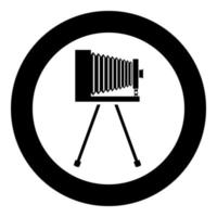 Retro camera on tripod Vintage analog film camera Old photo camera icon in circle round black color vector illustration flat style image