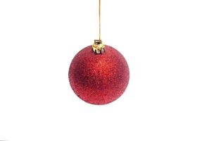 Red Christmas ball hanging on ribbon isolated on white background photo