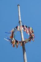 traditional german maypole against blue sky photo
