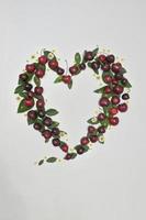 Heart Frame With Hello JulyText Ripe Red Cherries photo