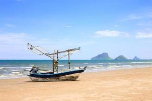 Traditional fishing boat on the beach photo