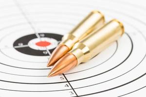 Rifle bullet over target background photo