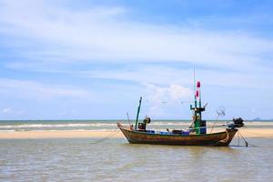 Traditional fishing boat on the beach photo