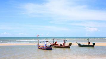 Traditional fishing boat on the beach photo