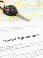 Car rental agreement with key and map photo