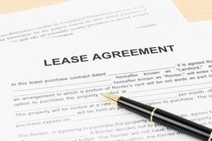 Lease agreement with pen, document is mock-up photo