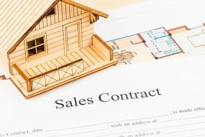 Sales contract agreement with model house photo