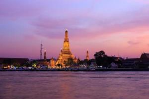 Wat arun or temple of dawn at twilight, bangkok, thailand photo