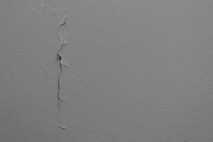 Vertical crack line of surface painted concrete. photo