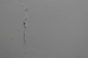 Vertical crack line of surface painted concrete. photo