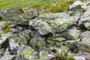 Fog, clouds, rocks and cliffs on Veslehodn Veslehorn mountain, Norway. photo