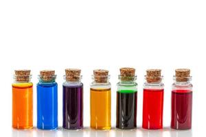 bottles of food coloring isolated on a white background photo