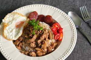 Chicken Rice Bowl with Fried Egg Chinese Style photo