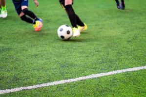 The footballers are competing in sports day of elementary school photo