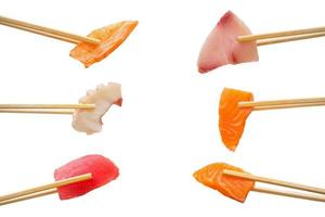 sashimi slice in chopsticks isolated on white background photo