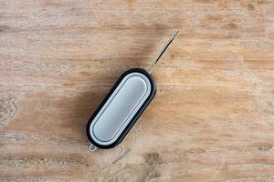 Car Key on old wood table background photo