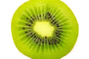 Slice of fresh kiwi fruit isolated on white background photo