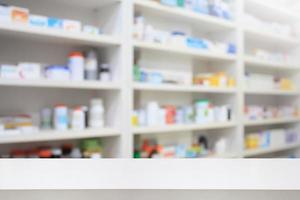 pharmacy product display counter with drugstore shelves photo