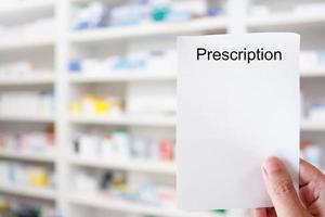 pharmacist hand holding prescription photo