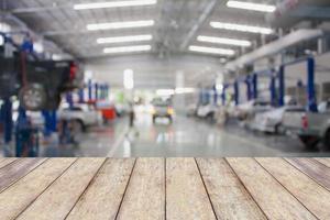 Wood table top with blur garage background photo