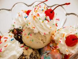 Ice cream scoops with cherry photo