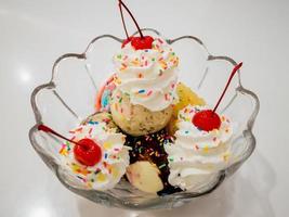 Ice cream scoops with cherry photo