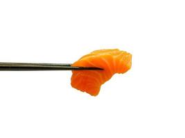 red salmon fish slice sashimi in chopsticks photo