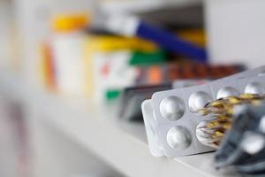 medicine pills on pharmacy shelf photo